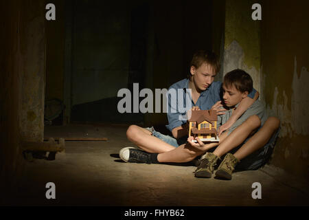 Little boys in a dark Stock Photo