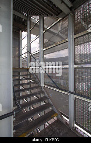 Example of a Metal and Steel Constructed Fire Escape with ability to see through the outer walls to the scenery outside Stock Photo