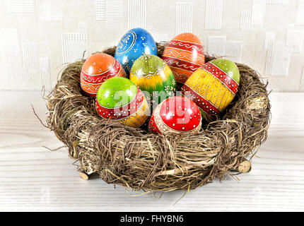 Easter eggs in nest. Colorful festive decoration Stock Photo