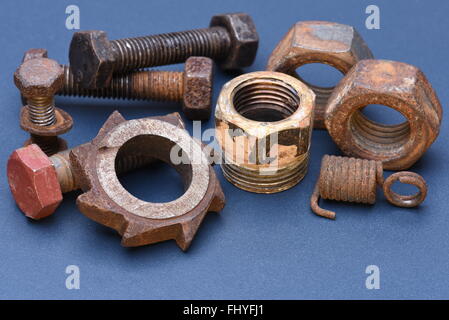 Old mechanical parts on blue metal background Stock Photo