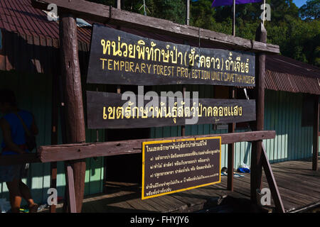 Sign at TAM GIA RAFT HOUSE on CHEOW EN LAKE in KHAO SOK NATIONAL PARK - THAILAND Stock Photo