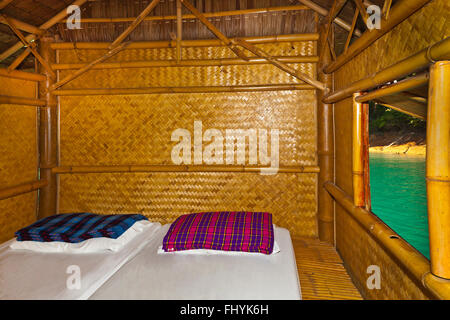 Interior of bedroom act NANG PRAI RAFT HOUSE on CHEOW EN LAKE in the KHAO SOK NATIONAL PARK - THAILAND Stock Photo