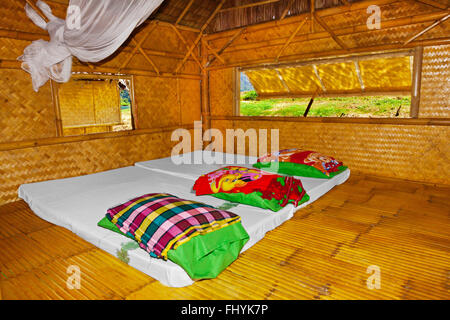 Sleeping room at KLONG KA RAFT HOUSE on CHEOW EN LAKE in the KHAO SOK NATIONAL PARK - THAILAND Stock Photo
