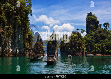 KARST FORMATIONS covered with tropical jungle at CHEOW EN LAKE in the KHAO SOK NATIONAL PARK - THAILAND Stock Photo