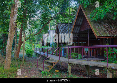 The RIVERSIDE COTTAGES in KHO SOK are a perfect place to stay to visit Kho Sok National Park - THAILAND Stock Photo