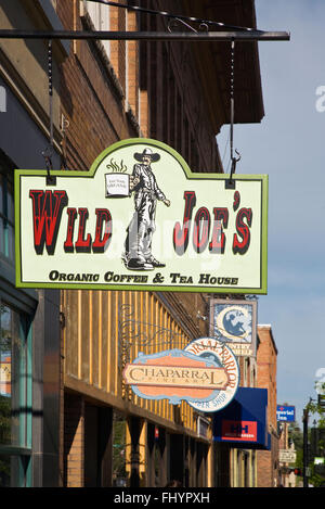 WILD JOES COFFEE SHOP SIGN on a historic brick building on MAIN STREET in BOZEMAN MONTANA the gateway to Yellowstone National Pa Stock Photo