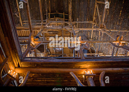 Log constructed interior of the historic OLD FAITHFUL INN was completed in 1904 - YELLOWSTONE NATIONAL PARK, WYOMING Stock Photo