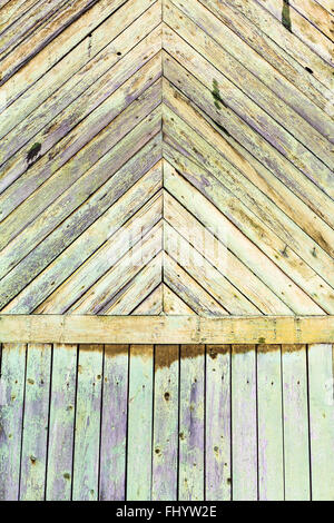 background from shabby green painted planks on wall of old wooden house Stock Photo