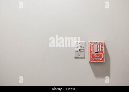 Fire alarm system and telephone connector port with separate clipping paths, copy space on concrete wall background Stock Photo