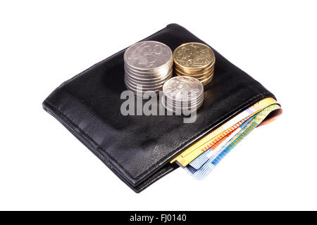 Stack of Australian coins on a black wallet isolated on white background Stock Photo
