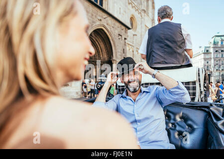 Austria, Vienna, couple having fun on sightseeing tour in a fiaker Stock Photo