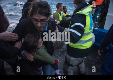 Refugees arriving on the shores of Efthalou, Lesbos in Greece. Stock Photo