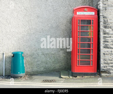 Traditional British red phone box converted to a defibrillator in Castleton, Derbyshire Stock Photo