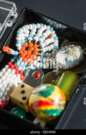 close up of a small box with old hand made toys that bring back memories Stock Photo