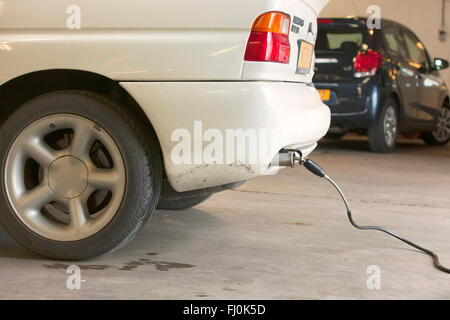 Check of the exhaust emissions of a passenger car during the annual safety inspection Stock Photo