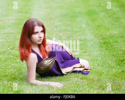 Girl student rests in the Park after school. Stock Photo