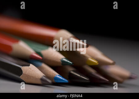 Group of colored pencils with shallow depth of field on black background Stock Photo