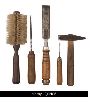Horizontal side view of a set of heavily used working tools isolated on white background Stock Photo