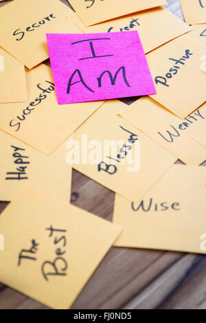 very powerful self help concept using positive messages and a I am floating above all the positive thoughts Stock Photo