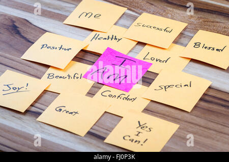 very powerful self help concept using positive messages and a I am floating above all the positive thoughts Stock Photo