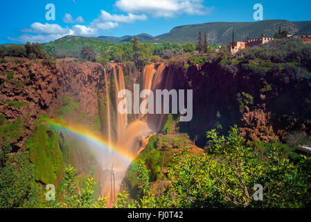 Beautiful Rainbow Over Muddy Waterfalls During Springtime in Ouzoud Falls, Near Marrakech, Morocco Stock Photo