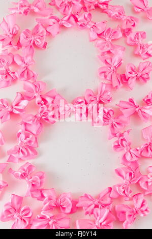 Figure of 8 made of small pink ribbons Stock Photo