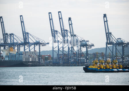 PANAMA CANAL, Panama--The Port of Balboa (Puerto de Balboa) near the southern entrance of the Panama Canal in Panama City, Panama. Opened in 1914, the Panama Canal is a crucial shipping lane between the Atlantic and Pacific Oceans that mean that ships don't have to go around the bottom of South America or over the top of Canada. The Canal was originally built and owned by the United States but was handed back to Panama in 1999. Stock Photo