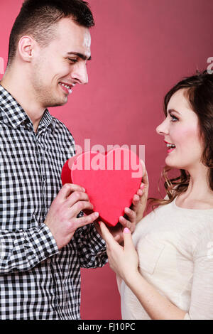 Romantic couple holding heart shape and kissing each other Stock Photo ...