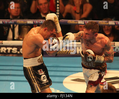 Manchester Arena, Manchester,UK 27th Feb 2016.  Carl Frampton vs Scott Quigg  IBF and WBA World Super Bantam Weight Championship Carl Frampton (Red/White/Gold) v Scott Quigg (Black/White/Gold)  Credit: Stephen Gaunt/Touchlinepics.com/Alamy Live News Stock Photo