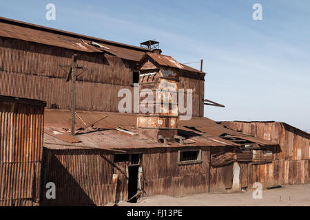 Abandoned industrial buildings and factories at Humberstone ghost, a former nitrate mining town in the Atacama desert. Stock Photo