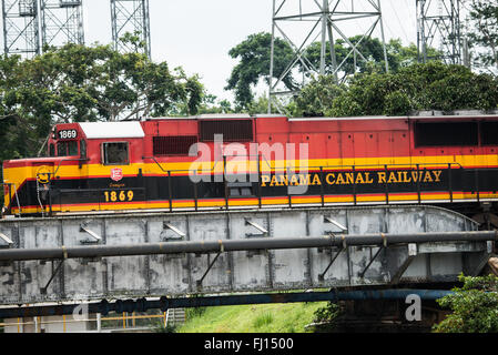 PANAMA CANAL, Panama--A train carrying shipping containers on the Panama Canal Railway. Opened in 1914, the Panama Canal is a crucial shipping lane between the Atlantic and Pacific Oceans that mean that ships don't have to go around the bottom of South America or over the top of Canada. The Canal was originally built and owned by the United States but was handed back to Panama in 1999. Stock Photo