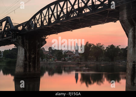 Sunset over the River Kwai bridge in Kanchanaburi, Thailand. The bridge was part of the famous death railways that the Japanses Stock Photo