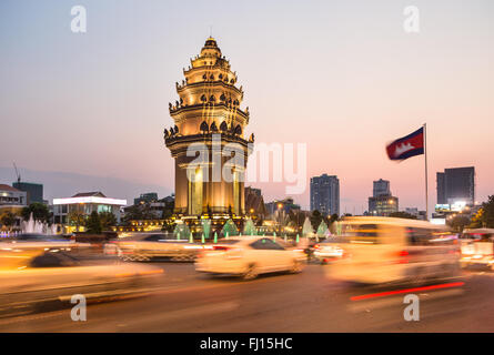 Traffic rush around the Independence monument, with its Khmer architecture style, in Phnom Penh, Cambodia capital city. Blurred Stock Photo