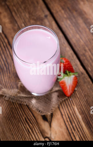 Strawberry Milk with fresh fruits on an old wooden table Stock Photo