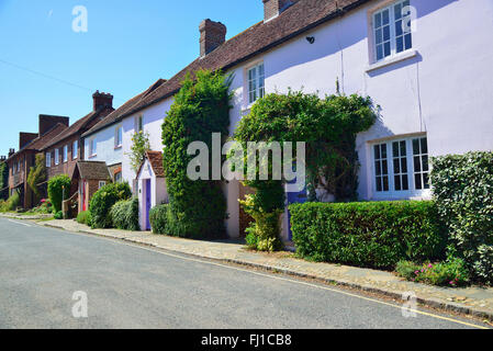 Pretty row of cottages in the main street through Itchenor village, on Chichester  Harbour, West Sussex, UK, England Stock Photo