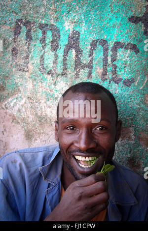 Man chewing  in Khat Harar, Ethiopia - people, architecture and streetlife Stock Photo