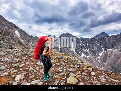 Hiking. Woman on pass . Eastern Sayan . Russia Stock Photo