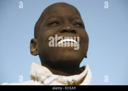 Mali amazing stunning portrait of black young malian child looking at the sky in Djenné , Mali Stock Photo