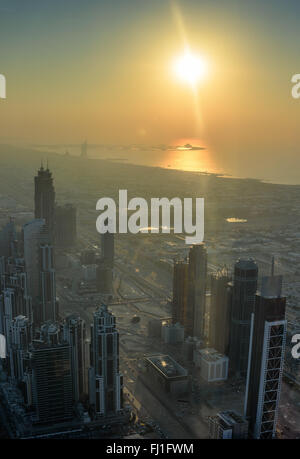 Skyscrapers during sunset in Dubai UAE, aerial view, lens flare Stock Photo