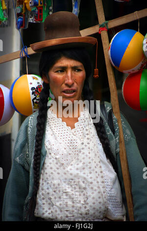 Portrait of Peruvian woman with traditional outfit and hat during celebrations in Puno , Titicaca , Peru Stock Photo