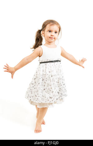 Cute little girl standing barefoot  isolated Stock Photo