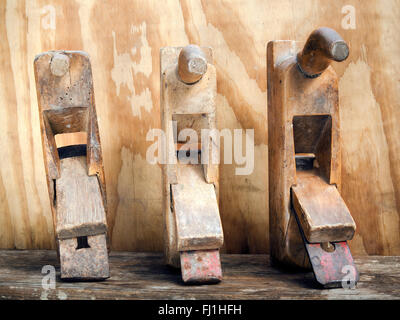 Old wood planers tools on wood background Stock Photo