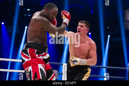 Halle, Germany. 27th Feb, 2016. Marco Huck (R, Germany) and Ola Afolabi (Great Britain) fight during the cruiserweight boxing match at the IBO World Championships in Halle, Germany, 27 February 2016. Marco Huck won in the 10th round. Photo: GUIDO KIRCHNER/dpa/Alamy Live News Stock Photo