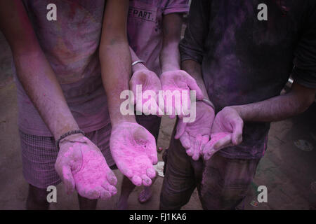 Hands covered with Holi pink colors during Holi festival in Vrindavan , India Stock Photo