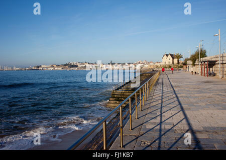 Portugal, promenade in resort town of Cascais by the Atlantic Ocean with stairs to the water Stock Photo