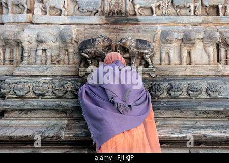 Woman praying at Jagdish Temple, Udaipur, Rajasthan, India Stock Photo