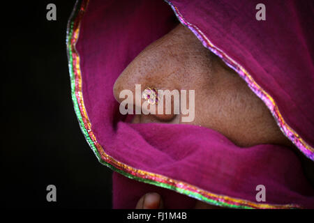 Woman nose ring piercing in Jaisalmer ,India Stock Photo