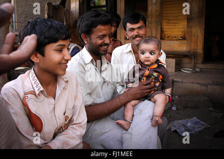 Men with baby in Jaisalmer, India Stock Photo