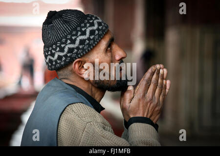 Muslim man praying at mosque Jama masjid , Old Delhi , India Stock Photo
