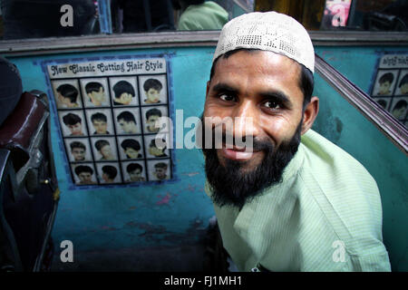 Muslim young man with Taqiyah (cap) and beard in Delhi, India Stock Photo